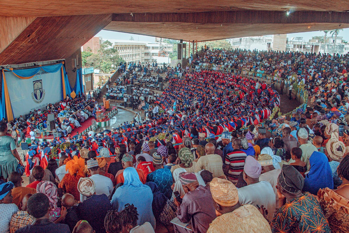 Large crowd seated in an auditorium — events setting